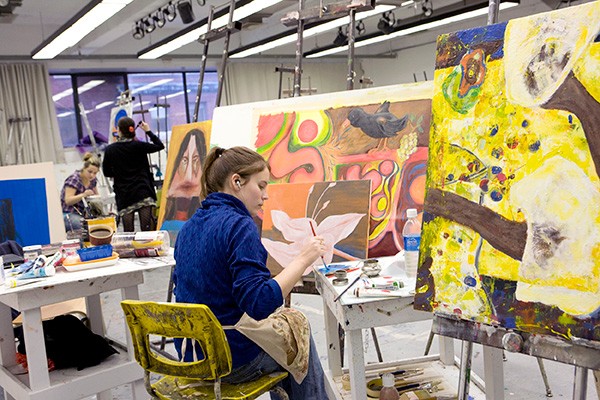 Student painting in studio