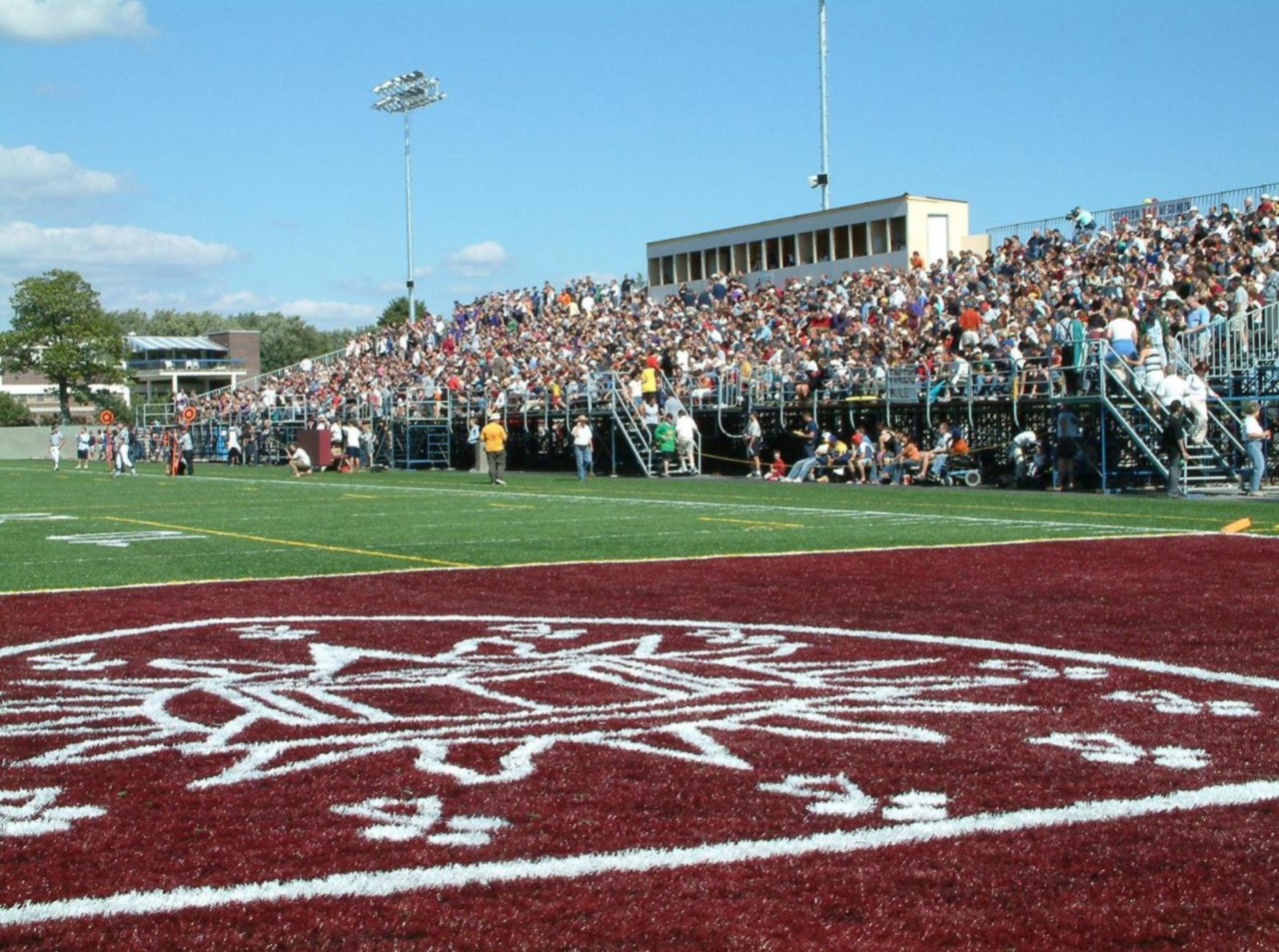 Home-opener football game and inauguration of the new field and temporary stadium