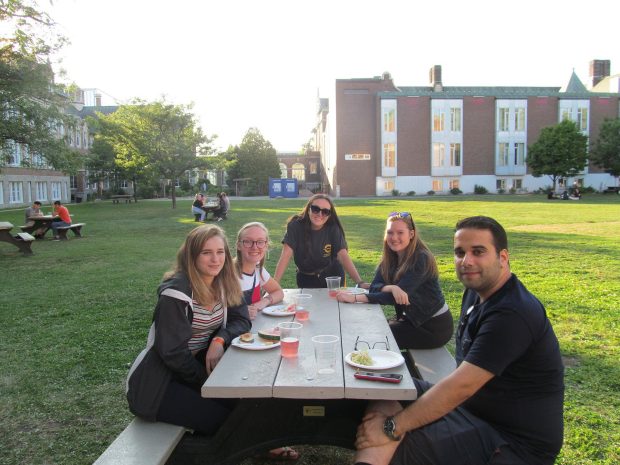Residence assistants enjoying an outdoor barbecue on the Loyola Campus.