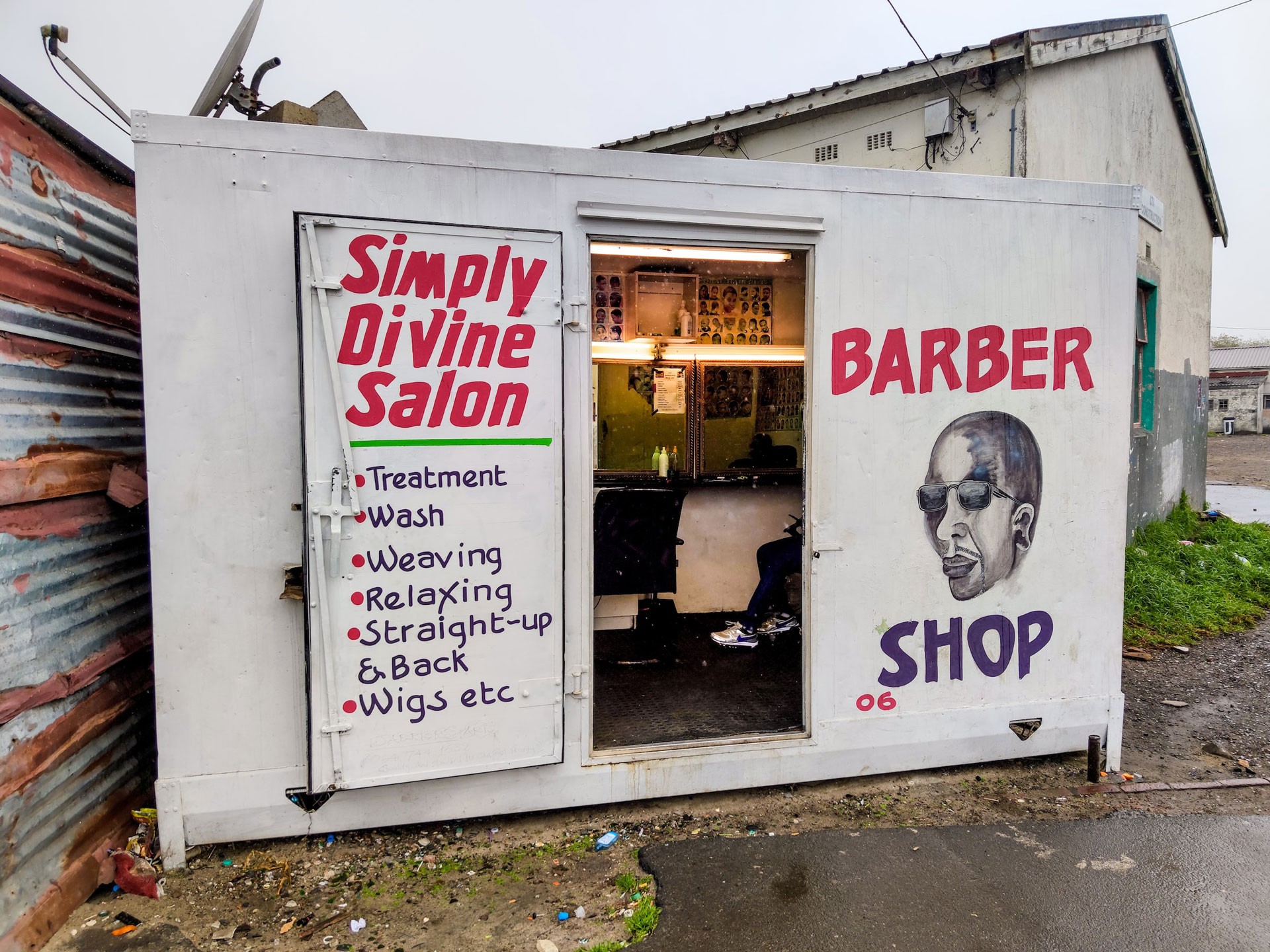 Barber shop sign listing services offered