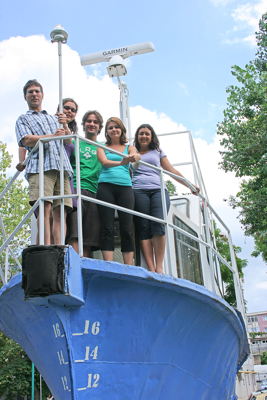 Linguistics professor Charles Reiss (left) stands with Oriana Kilbourn-Ceron,Christian Mutikainen, Sabina Matyiku, and Laurence Petitclerc on an amphibiousvehicle created at the university in Constan?a. Photo by Bianca Urdea