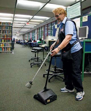 Monique Gosselin takes pride in her role as dedicated library concierge. “If I see something on the ground, I just pick it up.”