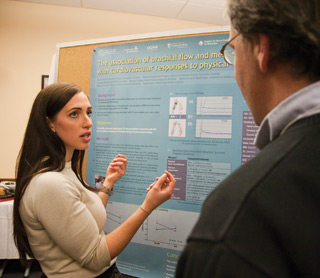 Amanda Rossi presents her research during a poster session at the International Graduate Course in Exercise and Clinical Physiology, October 26. | Photo by Concordia University