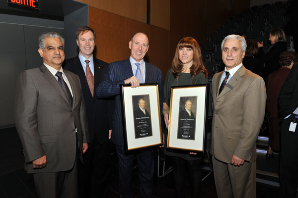 At the John Molson School of Business Awards of Distinction ceremony, held November 9 at the BMO Amphitheatre in the JMSB Building (from left to right): JMSB Dean Sanjay Sharma; Peter Kruyt, Chair of Concordia’s Board of Governors; Award of Distinction recipient Randall Kelly, president of Formula Growth Ltd.; Award of Distinction recipient Anna Martini, president of Groupe Dynamite Inc.; and Joseph Capano, Principal Director of Development, JMSB. | Photo by Ryan Blau/PBL Photography.