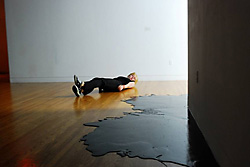 Aude Moreau, caution slippery floor, 2010. View of the installation with performer Élise Bergeron. | Photo: Alexandre Pilon-Guay.