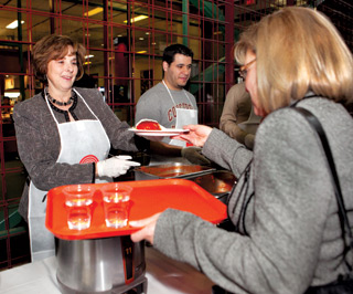President Judith Woodsworth serves pasta at the November 25 Centraide fundraising lunch. | Photo by Concordia University