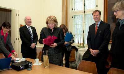 Christine St. Pierre, Provincial Minister of Culture, Communications and the Status of Women (centre) unwraps a gift from Concordia University after a presentation by Director of Facilities, Planning and Development Martine Lehoux (far left) on the background of the university’s acquisition of the Grey Nuns Motherhouse. Looking on are (from left) Provost David Graham, Chair of the Board of Governors Peter Kruyt and Dean of the Faculty of Fine Arts Catherine Wild. | Photo by Concordia University.