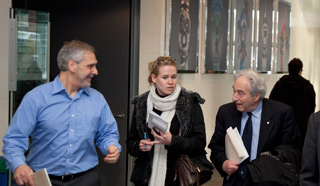 A Concordia staff member and a journalist chat with Dr. Lowy after the Senate meeting.