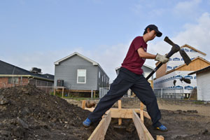 Third-year fine arts student Tae Hyun Kim helps build a foundation for a house to be erected in New Orleans as part of his Alternative Spring Break experience. | Photo courtesy of Julien Beaulieu.