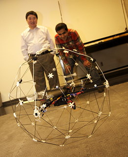 Professor Youmin Zhang and second-year Mechanical and Industrial Engineering PhD student Iman Sadeghzadeh (right) demonstrate the Qball in their 12th-floor EV Building lab. This type of technology “is not just my career at university. It’s my passion as well,” says Sadeghzadeh. | Photo Concordia University