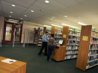 Associate University Librarian David Thirlwall (left) and Library Assistant Nadia Paszkiewicz in the J.W. McConnell Library Building Course Reserve Room. | Photo by Concordia University