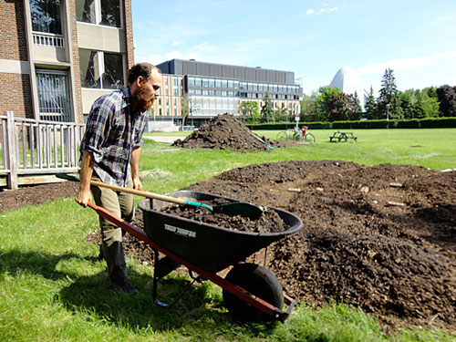 Marcus Lobb prepares gardens for planting.