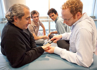 Concordia professor Gad Saad (seen here on the left, during an experiment with his graduate students) has published a new book called The Consuming Instinct: What Juicy Burgers, Ferraris, Pornography, and Gift Giving Reveal about Human Nature. | Photo by Concordia University 