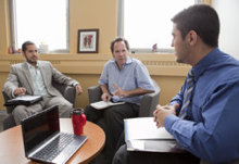 Dean of Students Andrew Woodall (centre) speaks with students. | Photo Concordia University
