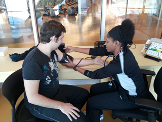 David has his blood pressure taken by PERFORM trainer Alicia Wright.