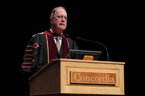 Honorary doctorate recipient Graham Fraser at the podium during the John Molson School of Business ceremony. He was recognized for eloquently upholding the value of bilingualism and for his ongoing defence of minority language rights.