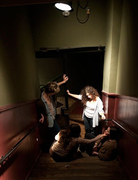 Michael Martini, Oyku Onder, Abigail Lieff and Silka Weil work on a sketch to be performed in the stairwell of the Corona Theatre.