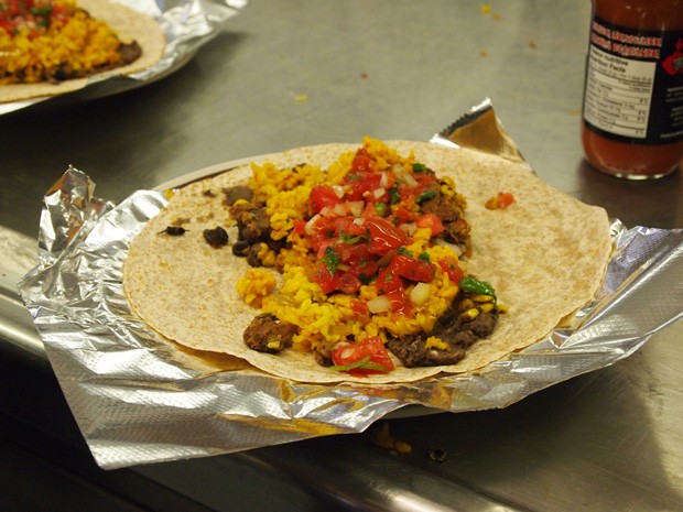 A finished burrito ready for rolling made by volunteers at Burrito Project Montreal. More than 400 are made each week.