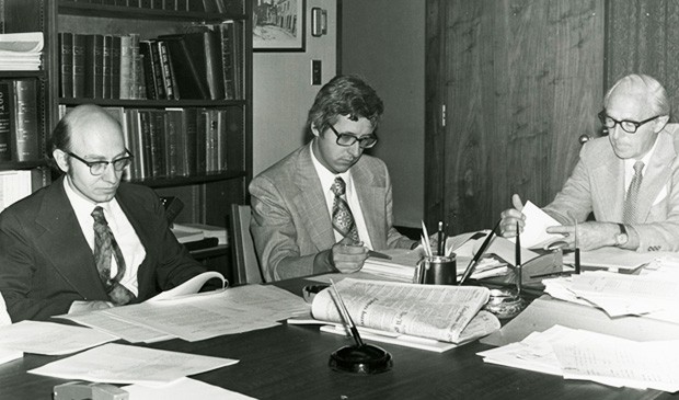 John O'Brien (left), Concordia's first rector and vice-chancellor, peruses documents during the final days of meetings with government officials to finalize the merger of Loyola College and Sir George Williams University to form Concordia. | Photo courtesy Records Management and Archives