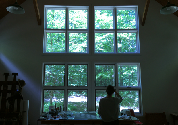 The studio windows looking out into nature. | Courtesy of the artist  