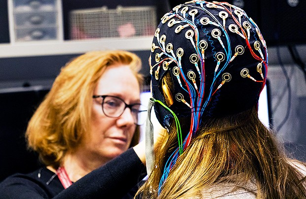 A cap embedded with electrodes allows researchers to complete an electroencephalogram test, which measures and records the electrical activity of your brain. | Photo courtesy: the PERFORM Centre Sleep Lab