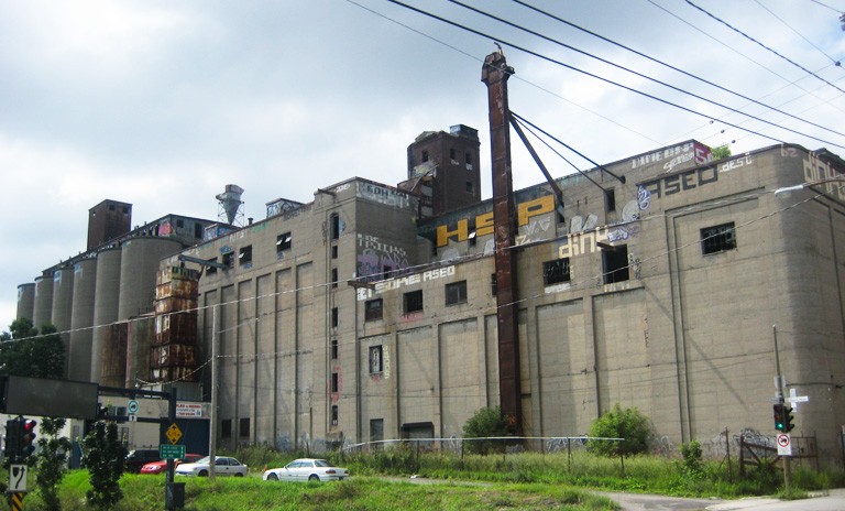 The old Canada Malting Company site in Saint-Henri has been identified by community collective À nous la Malting! as a major opportunity to expand social housing in the area. | Photo by Fredoues, via Wikimedia 