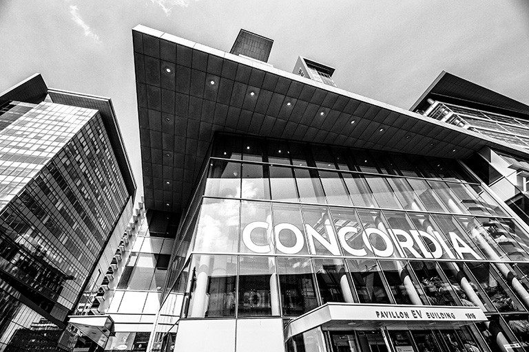 Black and white photograph of the front of the EV building on Concordia's downtown Campus.