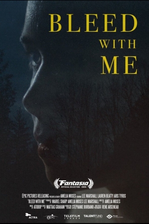 Film poster features a closeup of a face in silhouette, in the dark