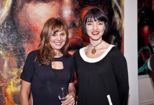 Kat Coric (right) with artist Corno at an art vernisage.