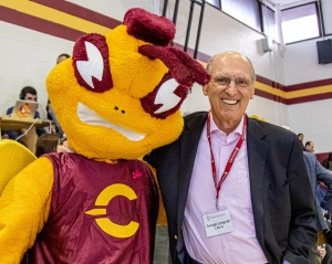 George Lengvari at a basketball game with Concordia's mascot