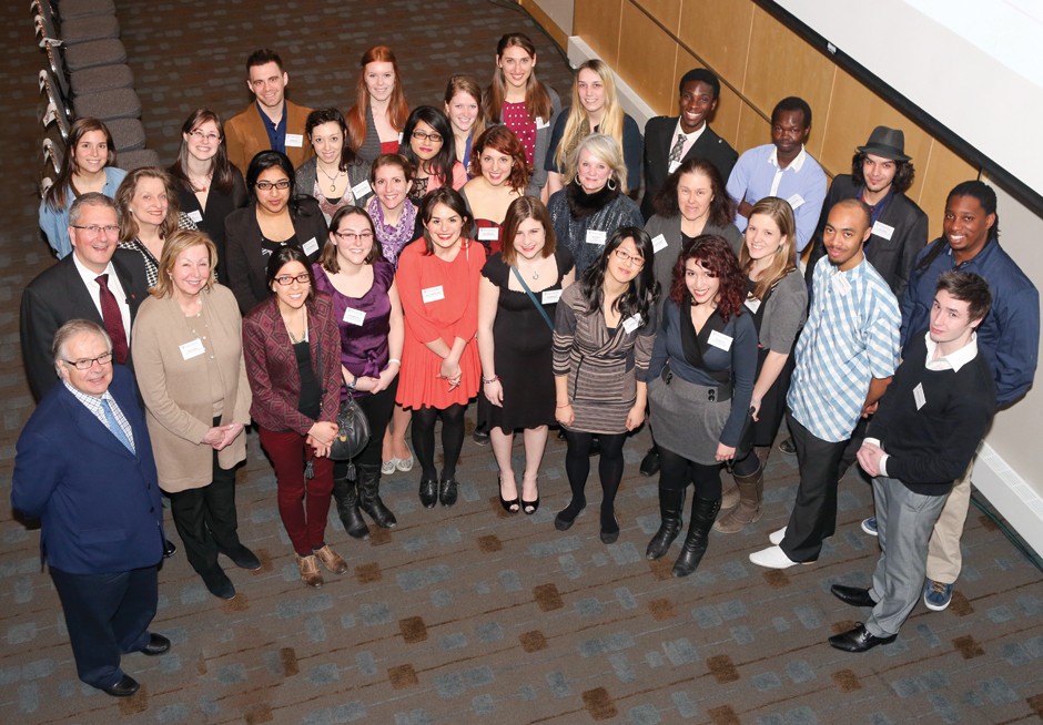 Richard J. Renaud in 2013 with some of the many students who have benefited from his generosity. 