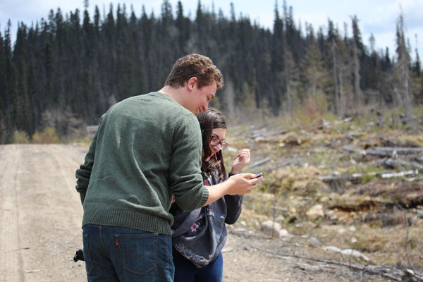 Concordia journalism students Gregory Todaro (left) and Casandra De Masi in a logged area north of Baie-Comeau, Que. | Photo credit: Michael Wrobel