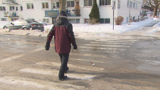 Michel St-Jean is almost completely blind and said the city should have cleared snow sooner. (Simon Nakonechny/CBC)