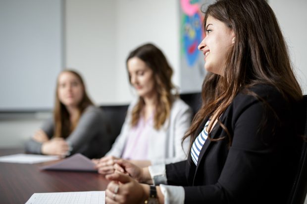 Concordia staff sit and listen to a lecture