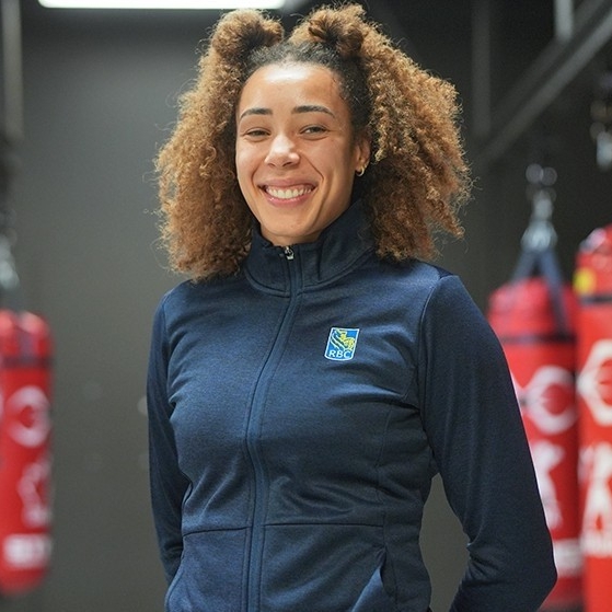 Tammara Thibeault Tammara Thibeault smiling in a boxing gym.