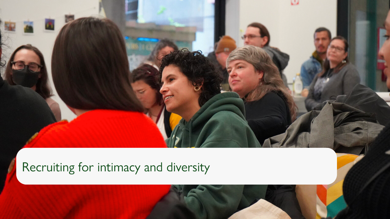 Slide with a photograph of an audience gathered at an event, with the person in focus speaking. The slide reads "Recruiting for intimacy and diversity".