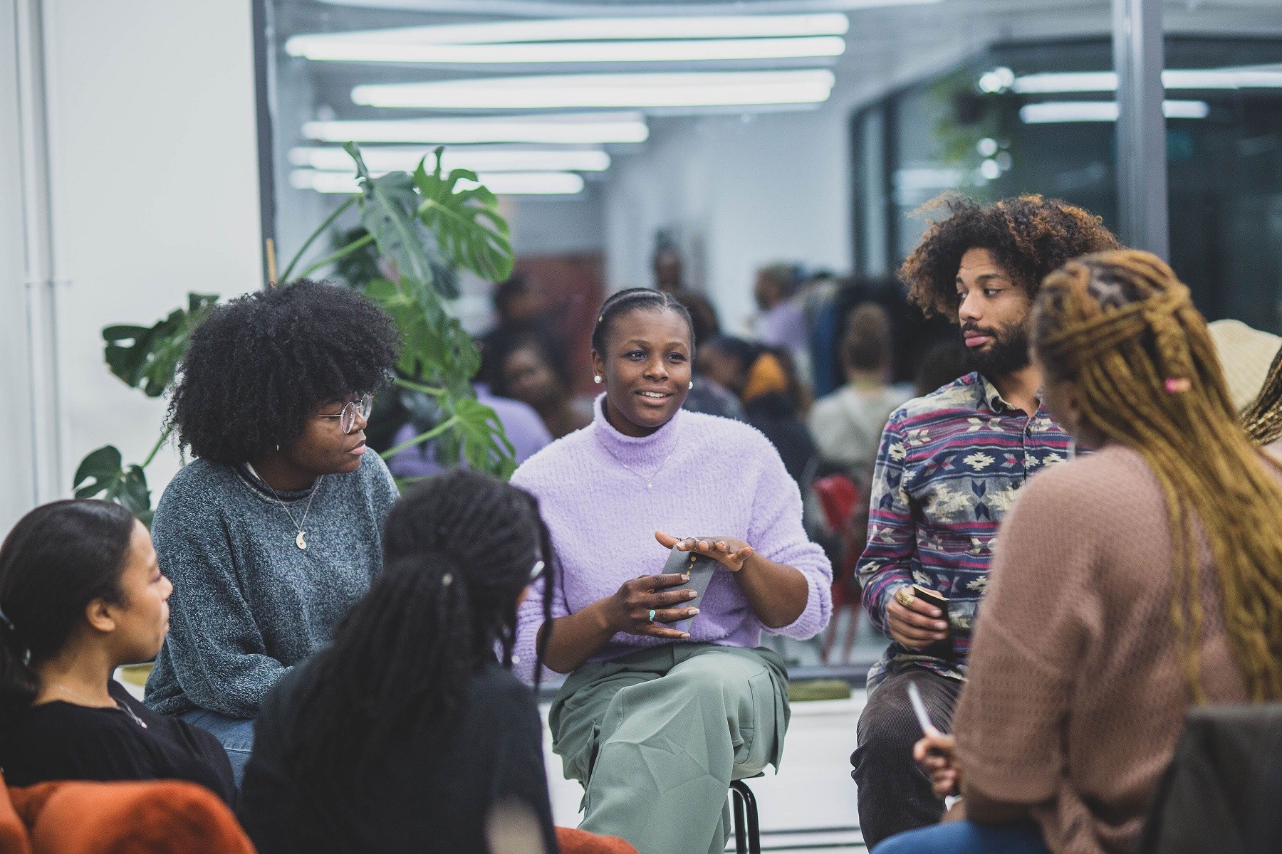 People gathering and speaking together in the SHIFT Centre