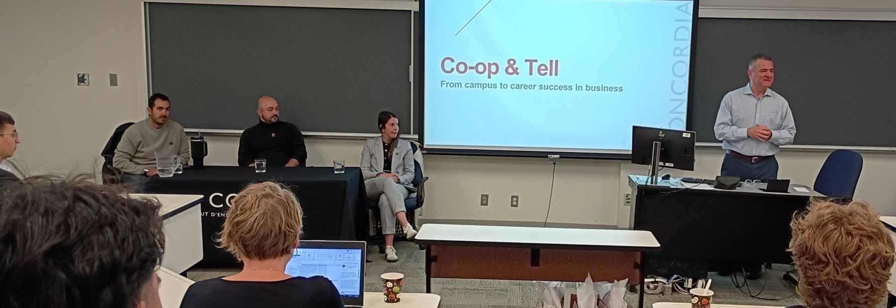 CARE 2025 panel event in a room full of students and employers