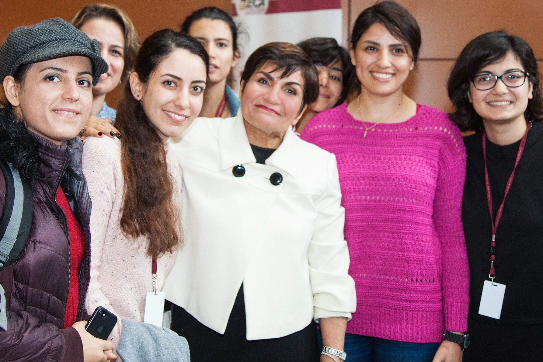 A group of women engineering students pose with Gina Cody