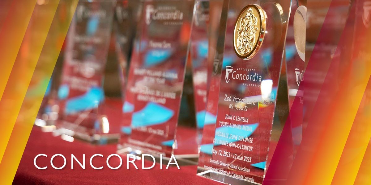 A row of awards are displayed on a table.