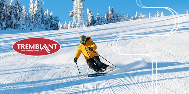 Tremblant logo superimposed on shot of a skier going down a snowy slope.