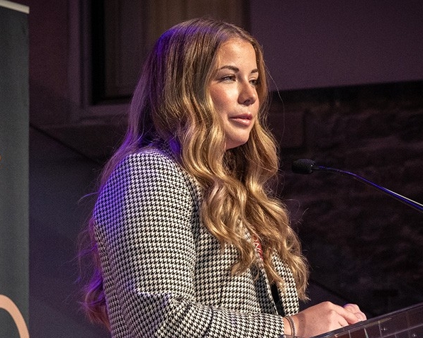 Woman at podium speaking