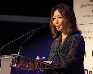 Woman at podium speaking