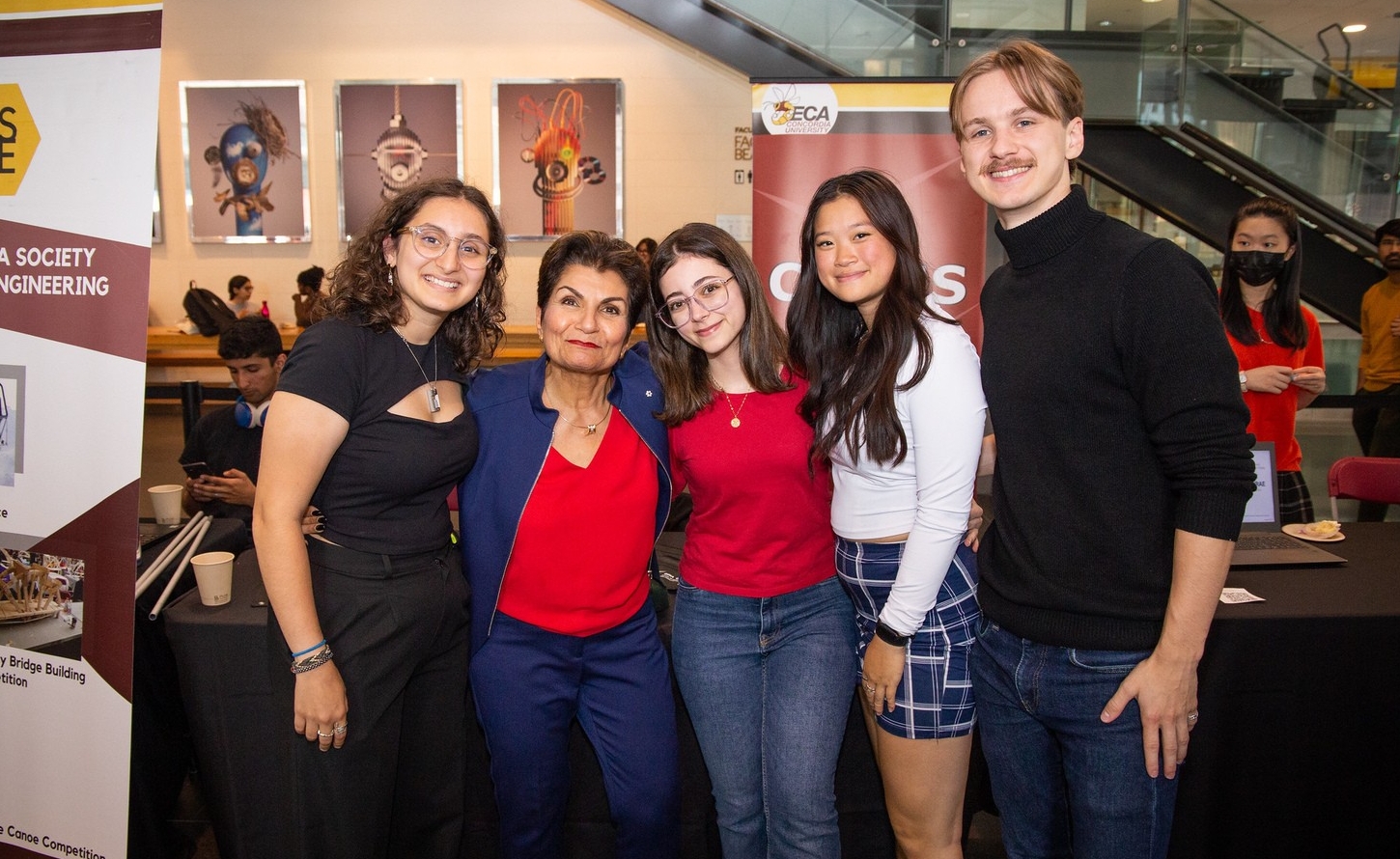 Concordia donor Gina Cody poses with students