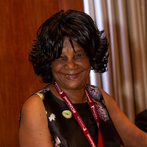 Lillian Jackson wears a black sleeveless dress with white dots and a Concordia lanyard around her neck