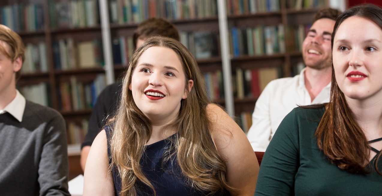 A room filled with smiling students