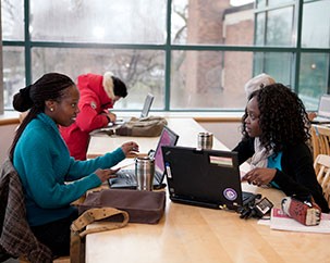 A photo of students in discussion in a library