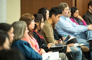 A photo of men and women sitting
