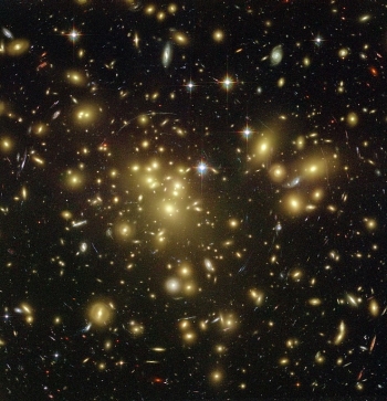 Galaxy cluster Abell 1689. Due to its large mass, it is useful for the study of dark matter and gravitational lensing. Source: European Space Agency (ESA)