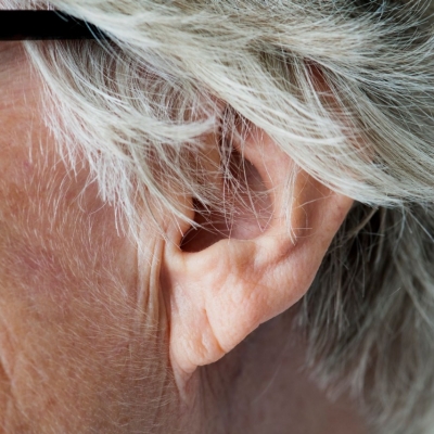 Close up of an older adult's ear